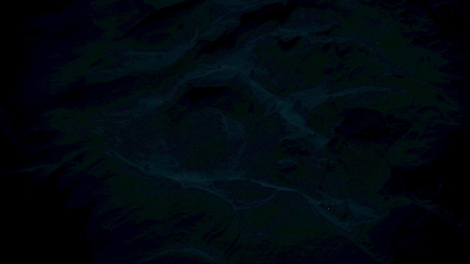 This is a dim image depicting a mountainous terrain with winding rivers.